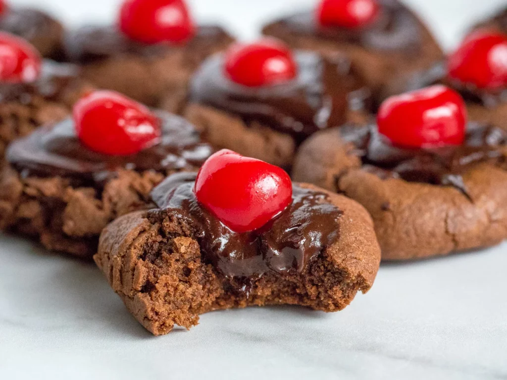 Chocolate santa cookies with chocolate and cherry on top