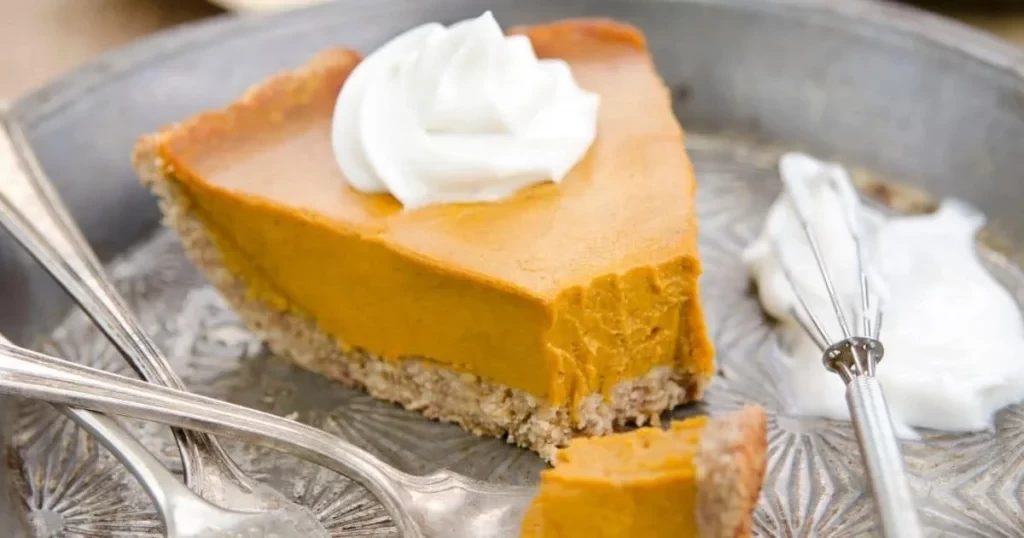 Pumpkin pie topped with whipped cream