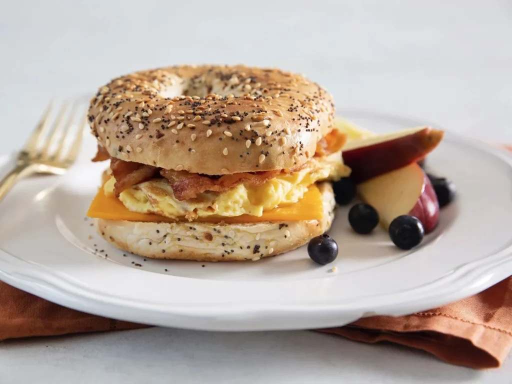 Fresh bagel sandwich with bacon and egg 