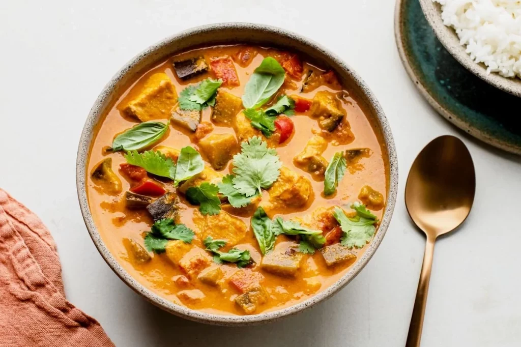 Appetizing bowl of Thai coconut curry chicken
