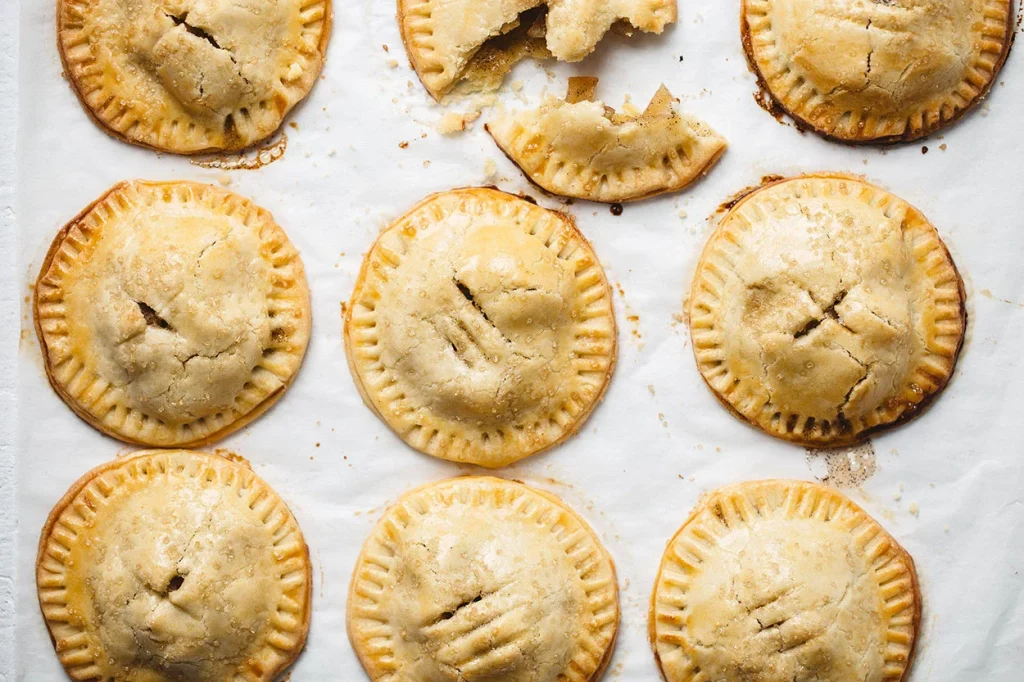 apple pie cookies on parchment paper