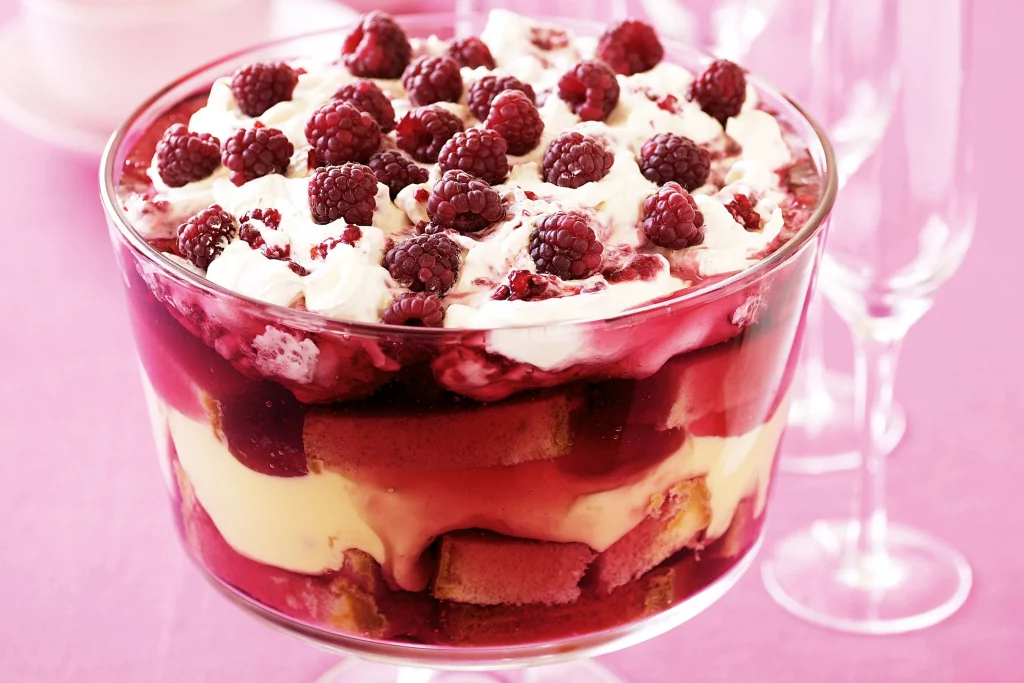 Raspberry trifle with egg custard and whipped cream