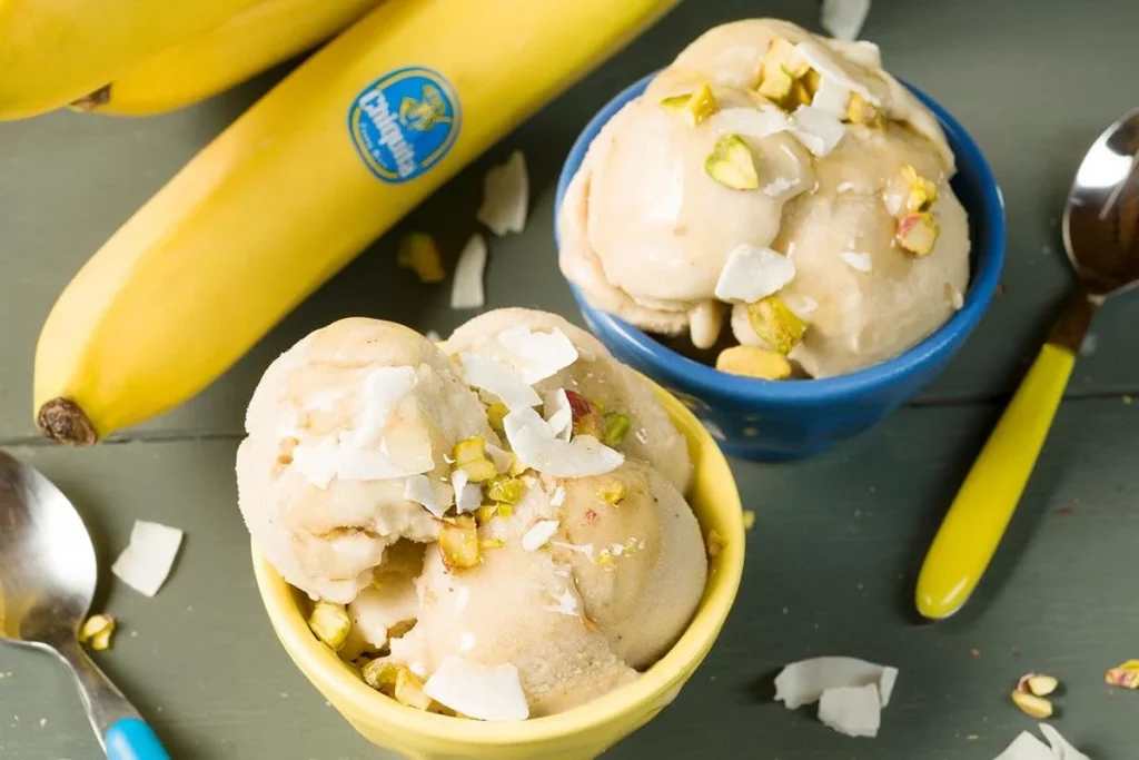 Banana ice cream with coconut and pistachio
