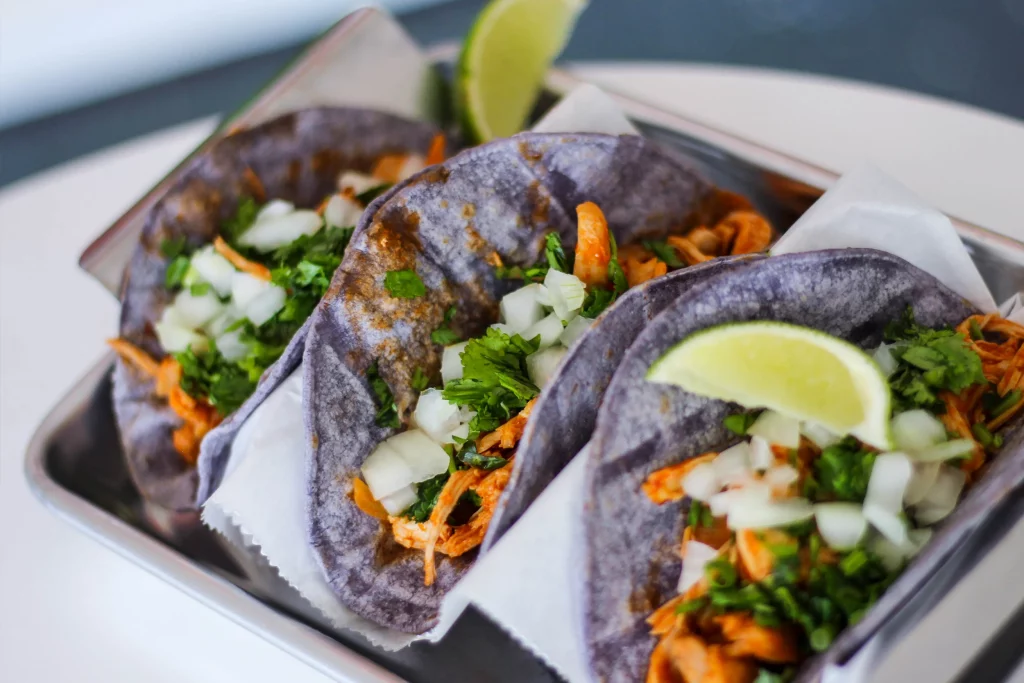 Blue corn taco with lemon and steak