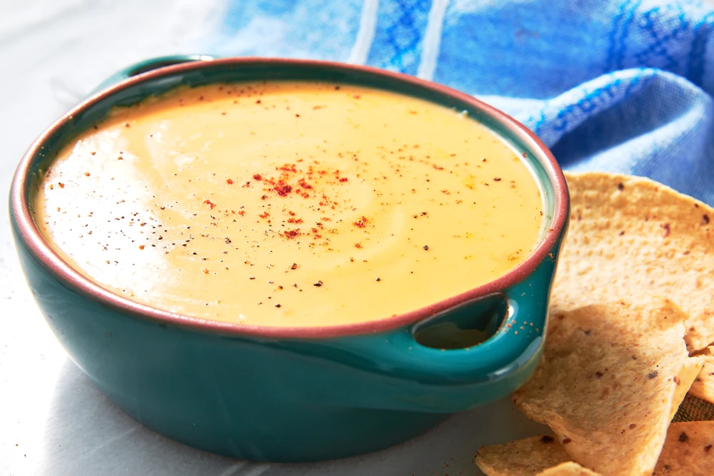 The creamy and cheesy sauce served in a bowl