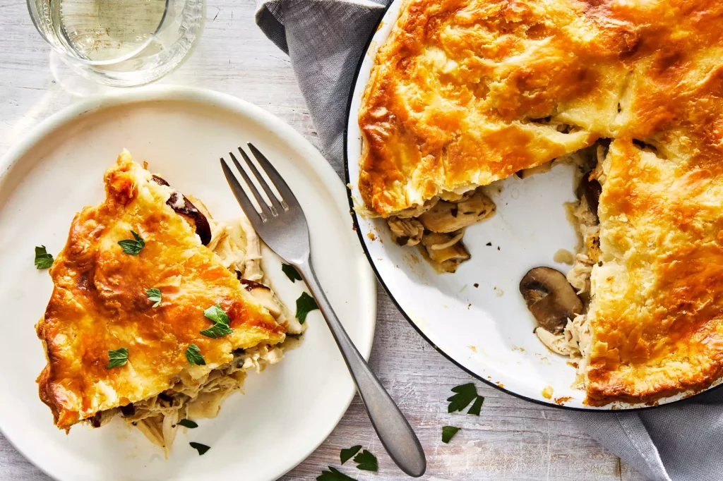 Sliced chicken and mushroom pie on a plate 