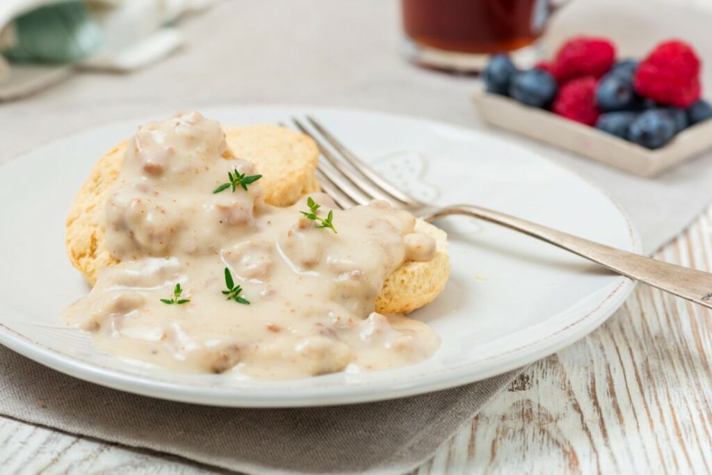 Biscuit And Gravy In Plate With Fork
