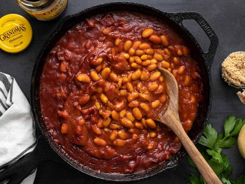 Baked Beans In Pot With A Big Wooden Spoon