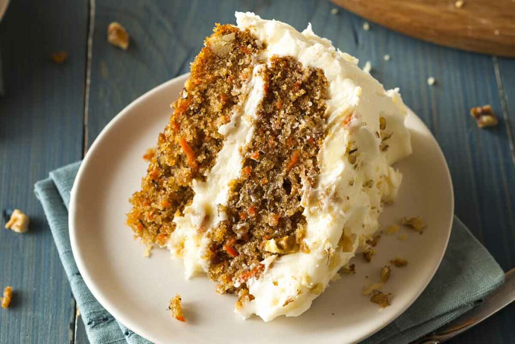 A Big Carrot Cake Slice In Plate
