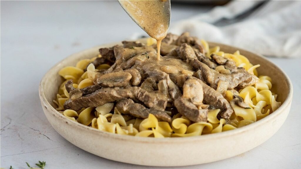 Hot Stroganoff Gravy Poured In Plate