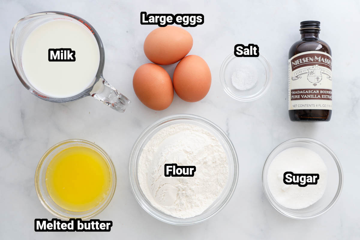 Ingredients for a German Pancake: milk, eggs, salt, vanilla extract, melted butter, flour, and sugar.