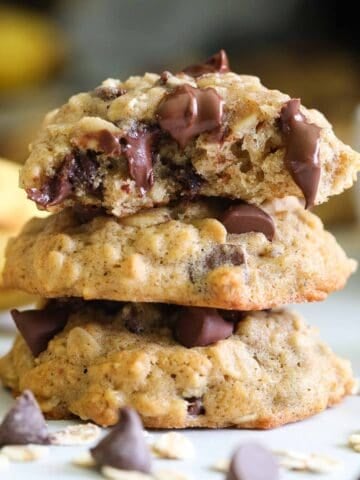 close up image of a stack of banana oatmeal chocolate chip cookies