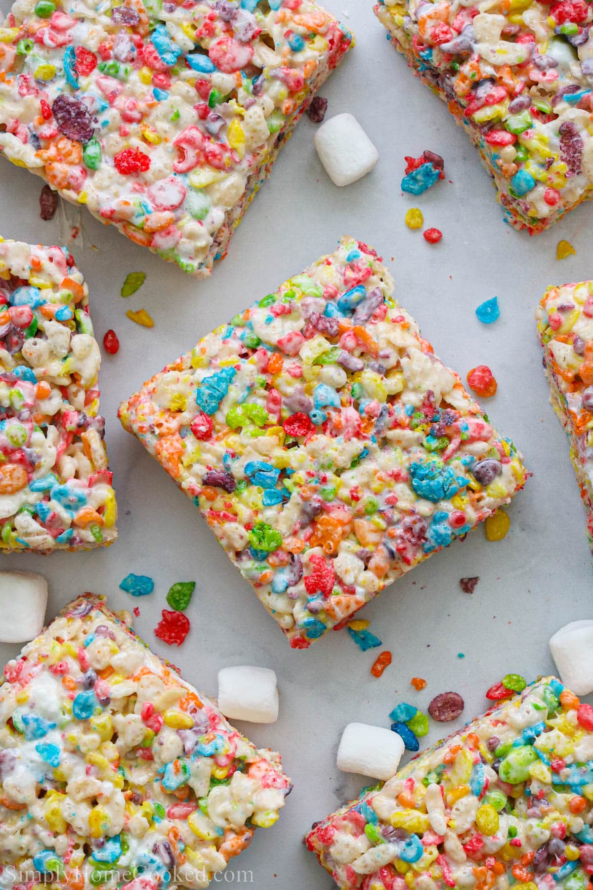 Fruity Pebbles Treats squares surrounded by mini marshmallows.