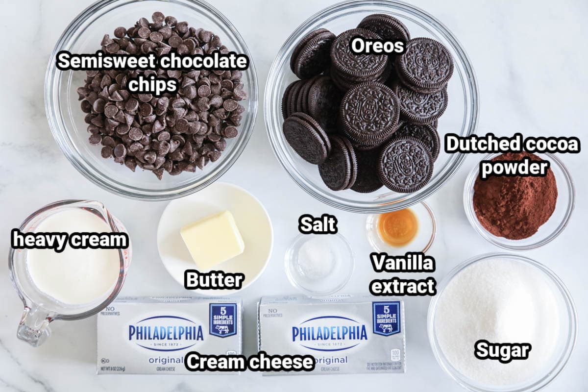 Ingredients for No-bake Chocolate Cheesecake Bars: semisweet chocolate chips, Oreos, Dutched cocoa powder, heavy cream, butter, salt, vanilla, sugar, and cream cheese.