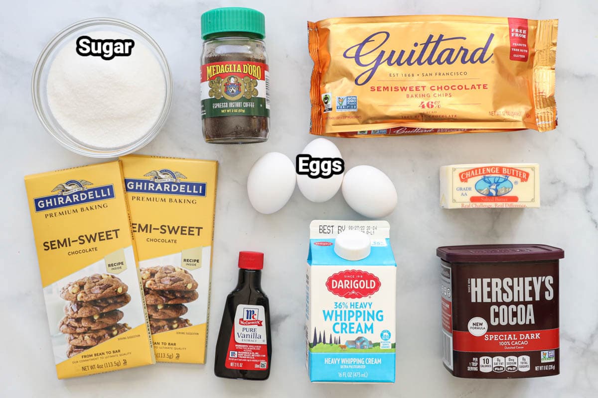 Ingredients for Flourless Chocolate Cake : sugar, espresso powder, semi sweet chocolate chips and baking chocolate, eggs, butter, heavy cream, vanilla extract, and cocoa powder.