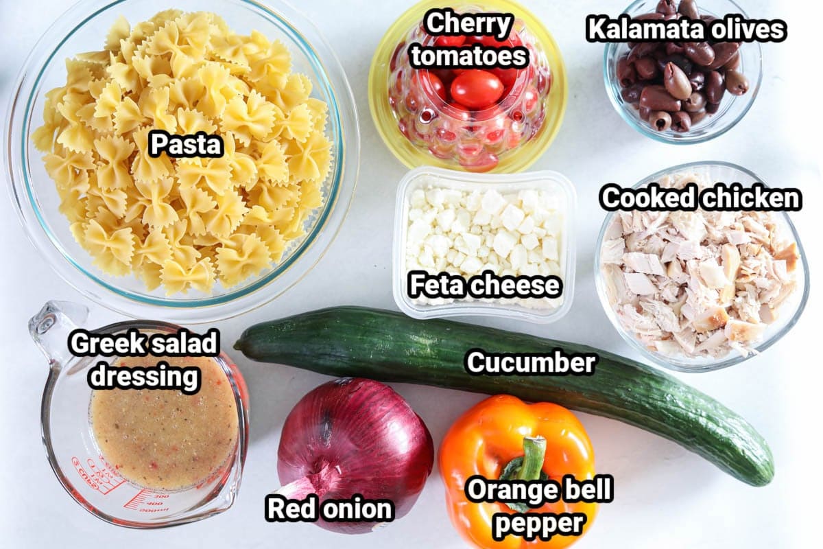 Greek Chicken Pasta Salad Ingredients Ingredients for Greek Chicken Pasta Salad: pasta, cherry tomatoes, kalamata olives, cooked chicken, feta cheese, cucumber, orange bell pepper, red onion, and Greek salad dressing.