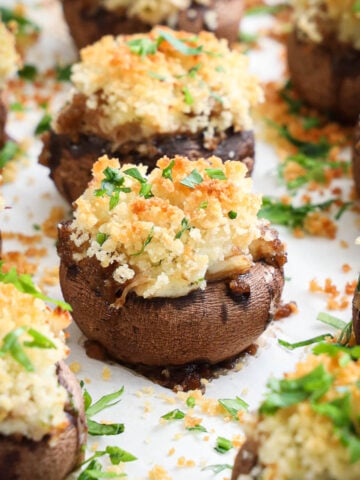 Closeup of Crab Stuffed Mushrooms covered in Panko breadcrumbs and parsley.