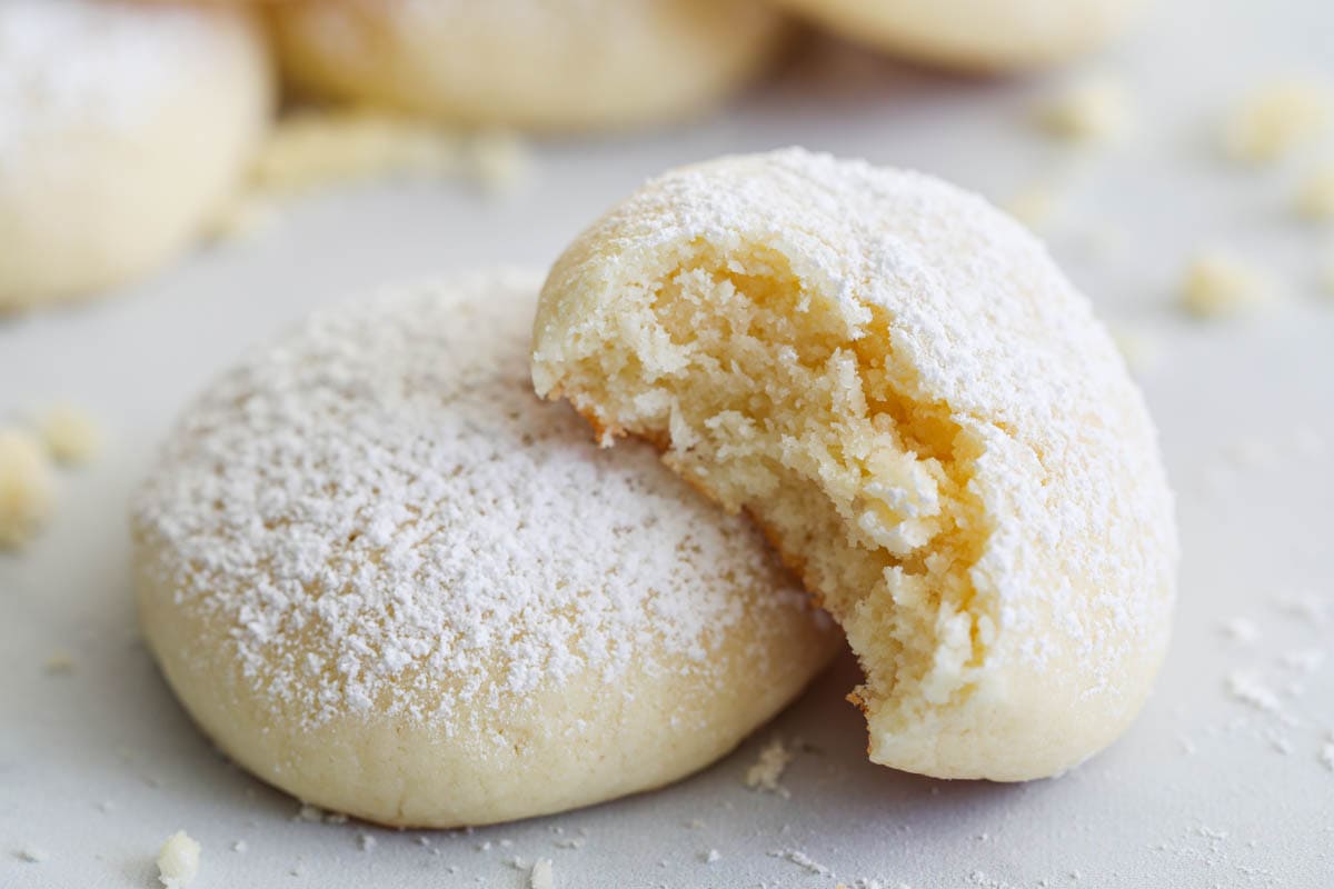 Cream Cheese Cookies, one missing a bite.