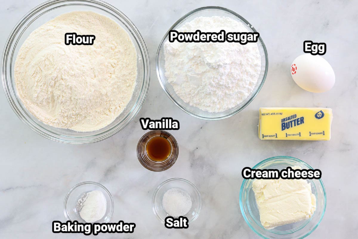 Ingredients for Cream Cheese Cookies: flour, powdered sugar, egg, butter, vanilla, baking powder, salt, and cream cheese.
