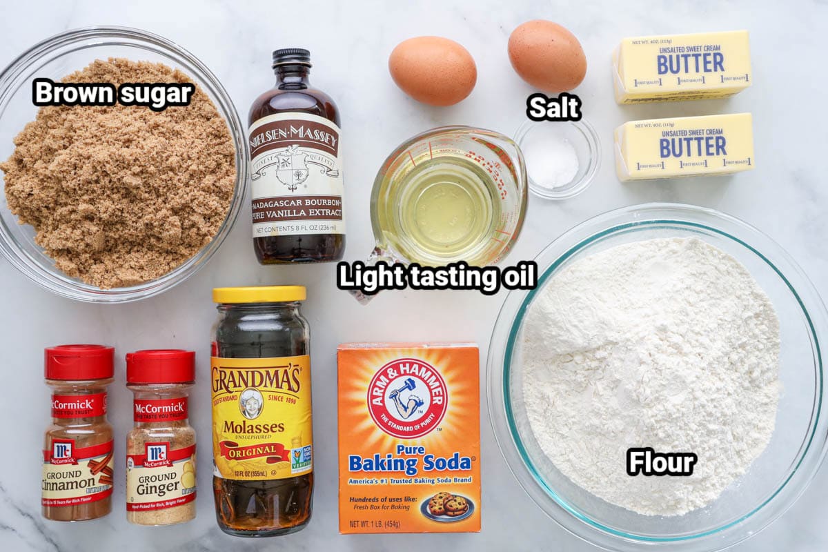 Ingredients for Ginger Molasses Cookies: brown sugar, flour, vanilla, ground ginger, cinnamon, molasses, baking soda, oil, eggs, salt, and butter.