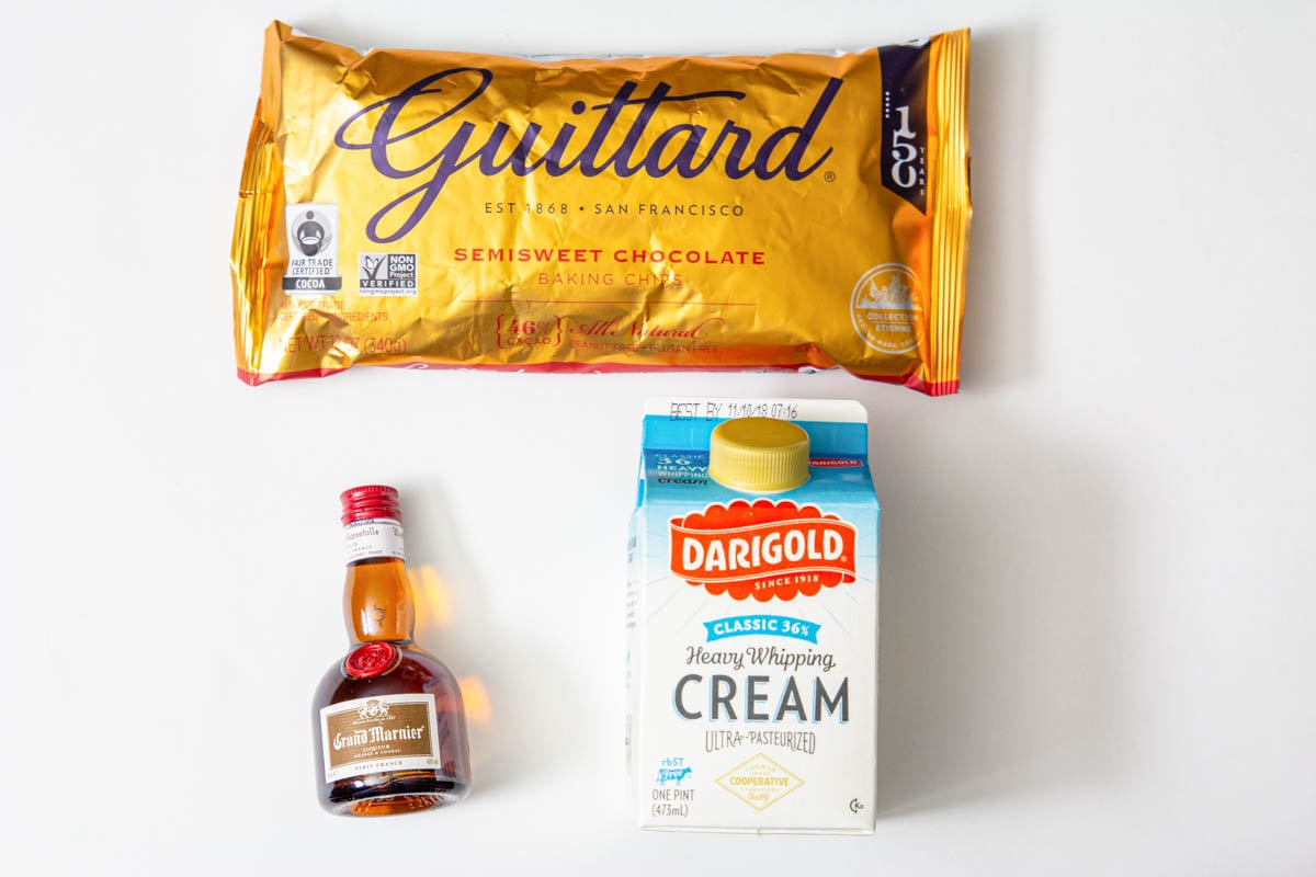 Ingredients for chocolate ganache for Cranberry Orange Bundt Cake: chocolate chips, heavy cream, and Grand Marnier.