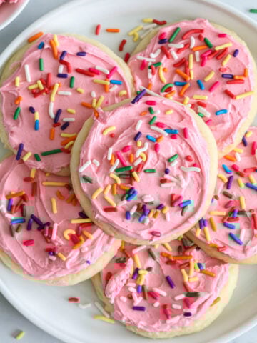 overhead image lofthouse frosted sugar cookies with rainbow sprinkles