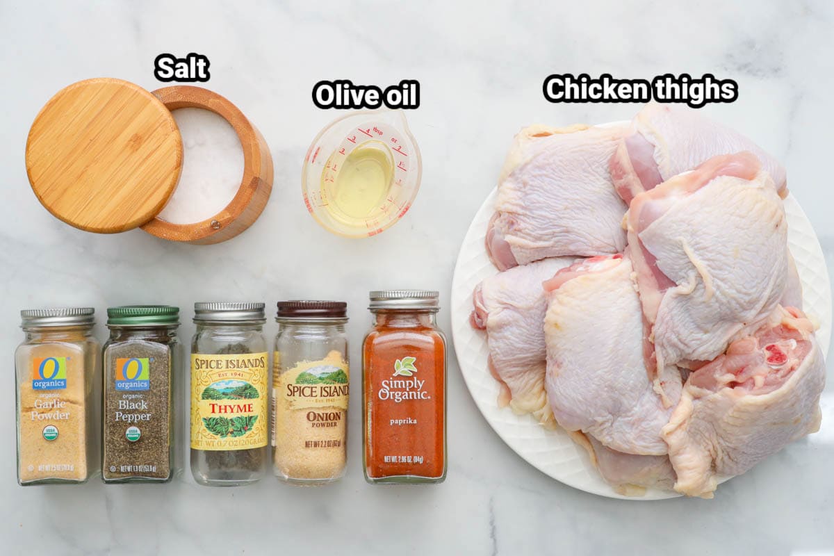 Ingredients for Crispy Baked Chicken Thighs: chicken thighs, salt, olive oil, garlic powder, onion powder, thyme, black pepper, and paprika.