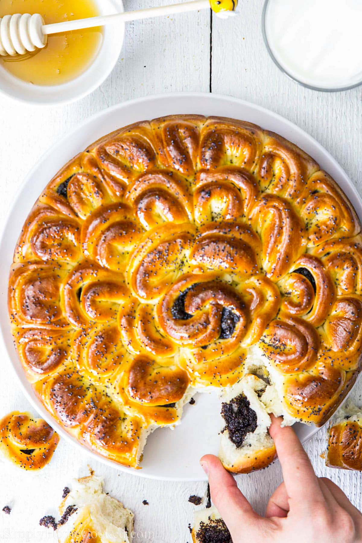 A piece of Poppy Seed Pull Apart Bread: being pulled out.