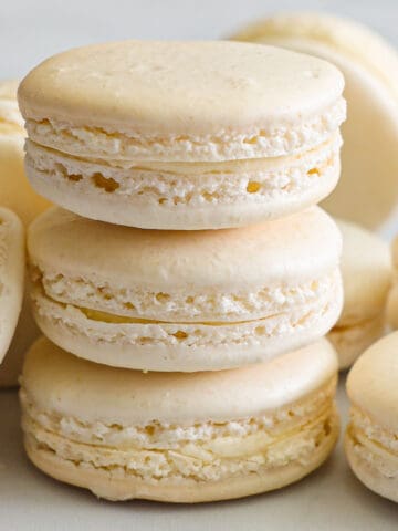 Stack of Vanilla Macarons with more nearby